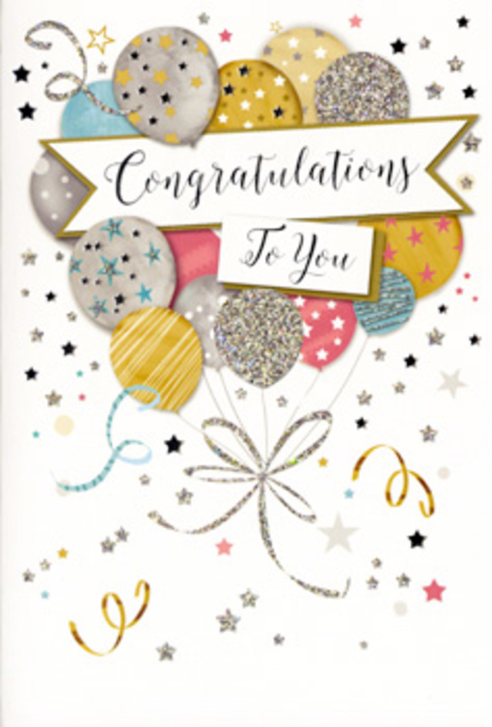 This photograph presents a beautifully designed congratulations card, its artwork echoing the charm and quiet pride often felt during milestone moments in Downe and the surrounding countryside. Central to the design is a generous cluster of balloons rendered in soft, harmonious shades: gleaming gold, cool silver, creamy champagne, light sky blue, blush-tinted pink, and subtle grey. The balloons overlap in a way that creates gentle depth, as if some are floating slightly in front of others, forming an airy bouquet above an unseen celebration table. Each balloon is embellished with fine metallic details-dotted stars, slim stripes, and shimmering flecks that resemble delicate glitter-giving the card a refined sparkle that calls to mind sunlight glancing off party decorations near the gardens of High Elms. Stretching across the cluster is a graceful banner, curling just at the ends to suggest movement. On this banner, Congratulations To You is written in ornate, flowing script, the strokes of the letters elegant but still comfortably readable. Around this focal point, thin lines and curling ribbons sweep and swirl in metallic gold and silver, creating a sense of gentle motion, much like ribbons caught in a soft breeze along the country lanes outside Downe. The background is a pale, unobtrusive tone, lightly dusted with tiny stars and confetti specks that add a festive atmosphere without cluttering the scene. Although no flowers appear in the illustration, the overall effect pairs naturally with a fresh bouquet chosen to mark achievements such as graduations, promotions, anniversaries, or new beginnings. The card's design feels like a paper echo of a heartfelt well done, ideal for resting beside a vase of seasonal blooms in a Downe home or village hall during a celebratory gathering.