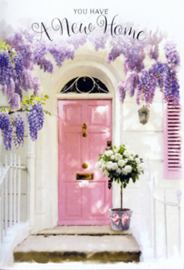 A peaceful doorway scene in Downe captures the romance of rural village life and the quiet thrill of a fresh start. The front door is painted a gentle shade of blush pink, its colour echoing the softness of early morning skies over the fields just beyond the village. The door sits within a whitewashed wall that feels aged in a charming way, with a softly toned shutter to one side, all bathed in a calm, flattering light. Overhead, abundant wisteria spills down in trailing clusters, the blooms a medley of lavender, lilac, and soft purple hues. Each raceme of flowers creates a vertical veil, framing the door with a natural arch that gives the entrance a sense of intimacy and secluded beauty, reminiscent of a tucked-away cottage path leading off from Downe's quiet streets. At the foot of this floral canopy rests a large tin bucket, slightly weathered, filled to brimming with creamy white roses. The roses are lush and fully open, their petals layered like ruffles of delicate fabric, arranged with an experienced hand so that every bloom has room to breathe. Gentle green foliage is threaded through the bouquet, adding texture and the impression that the arrangement could have been freshly cut from local gardens. A satin ribbon in pale pink is tied snugly around the bucket, its bow sitting just off-centre, the ends lying in relaxed curves across the stone step. The entire setting radiates a sense of tender optimism-ideal for a housewarming delivery to a new address in Downe, or a thoughtful floral gesture to welcome someone back. You can almost imagine the scent of roses mingling with the wisteria, carried on the breeze, filling the threshold with an inviting promise of warmth, companionship, and memories waiting to unfold.