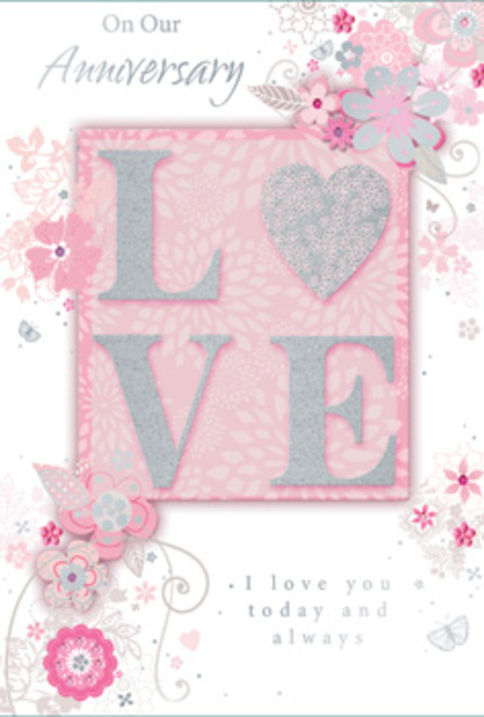 An open anniversary card lies flat as if ready to accompany a hand-delivered bouquet from Downe Flowers, its layout bathed in gentle, welcoming light. The central motif is the word LOVE, styled in an elegant, slightly elongated font, each letter raised and finished with a frosted, glittering layer. This shimmering texture catches the eye the way sunlight catches fine china on a Downe windowsill, creating playful reflections without overwhelming the softness of the overall design. Around this word, airy, hand-drawn blossoms cluster along the borders in harmonious shades of pink, lilac-tinged blush, and creamy ivory. They feel as if they've been sketched by someone who knows flowers intimately, each petal and leaf arranged with the same care that goes into tying a ribbon around a romantic anniversary bouquet. Slender stems and curls of foliage weave between the blooms, giving the card a sense of drift and movement, like petals carried on a gentle breeze across the gardens and lanes near Downe. Fine flourishes - delicate filigree lines, dainty leaves, and almost-hidden butterflies - tuck themselves into the spaces between the flowers, inviting a second, slower look. The background maintains a soft, powder-pink tone that allows the glittered letters and pastel flowers to glow, while still preserving a warm, understated elegance. Set among the artwork, the message I love you today and always appears in refined, understated type, steady and reassuring, like a promise made long ago and kept every day since. The card feels less like a simple greeting and more like a paper bouquet: quietly fragrant in spirit, thoughtfully arranged, and ready to mark an anniversary in Downe with deep affection.